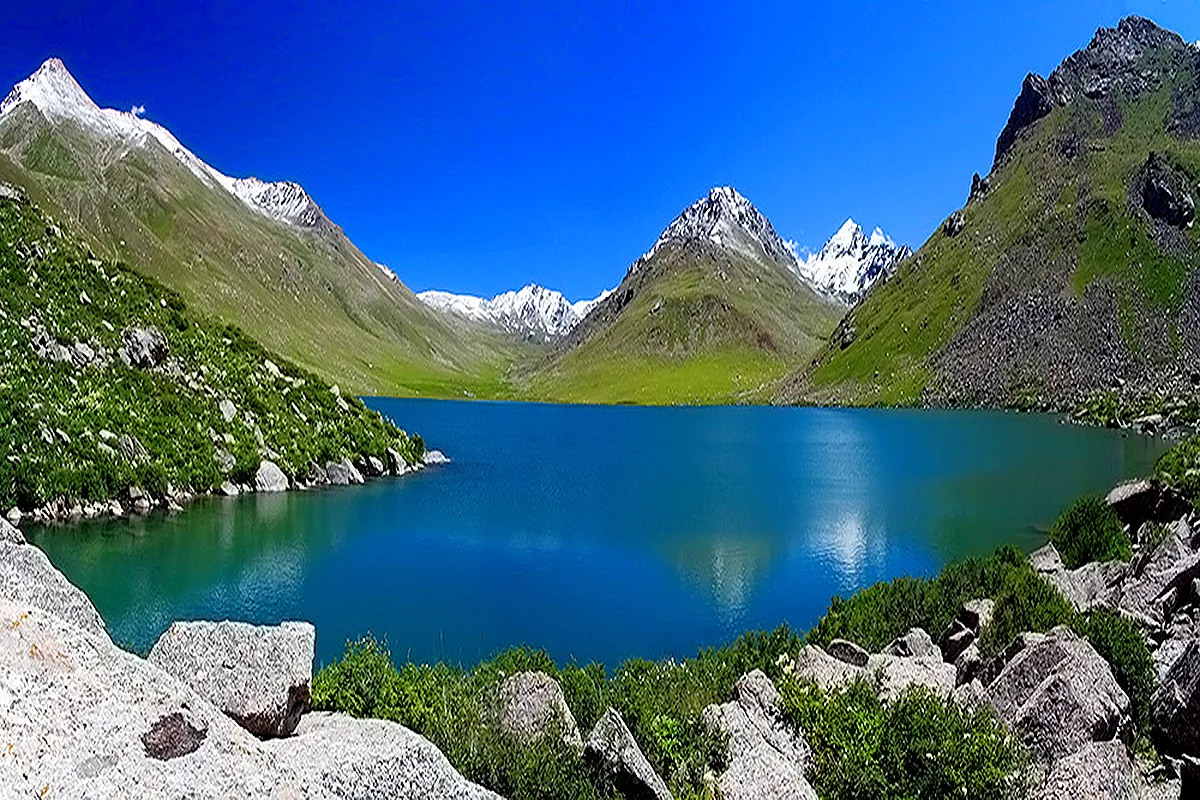 Turquoise Besh-Tash lake among bare mountain slopes