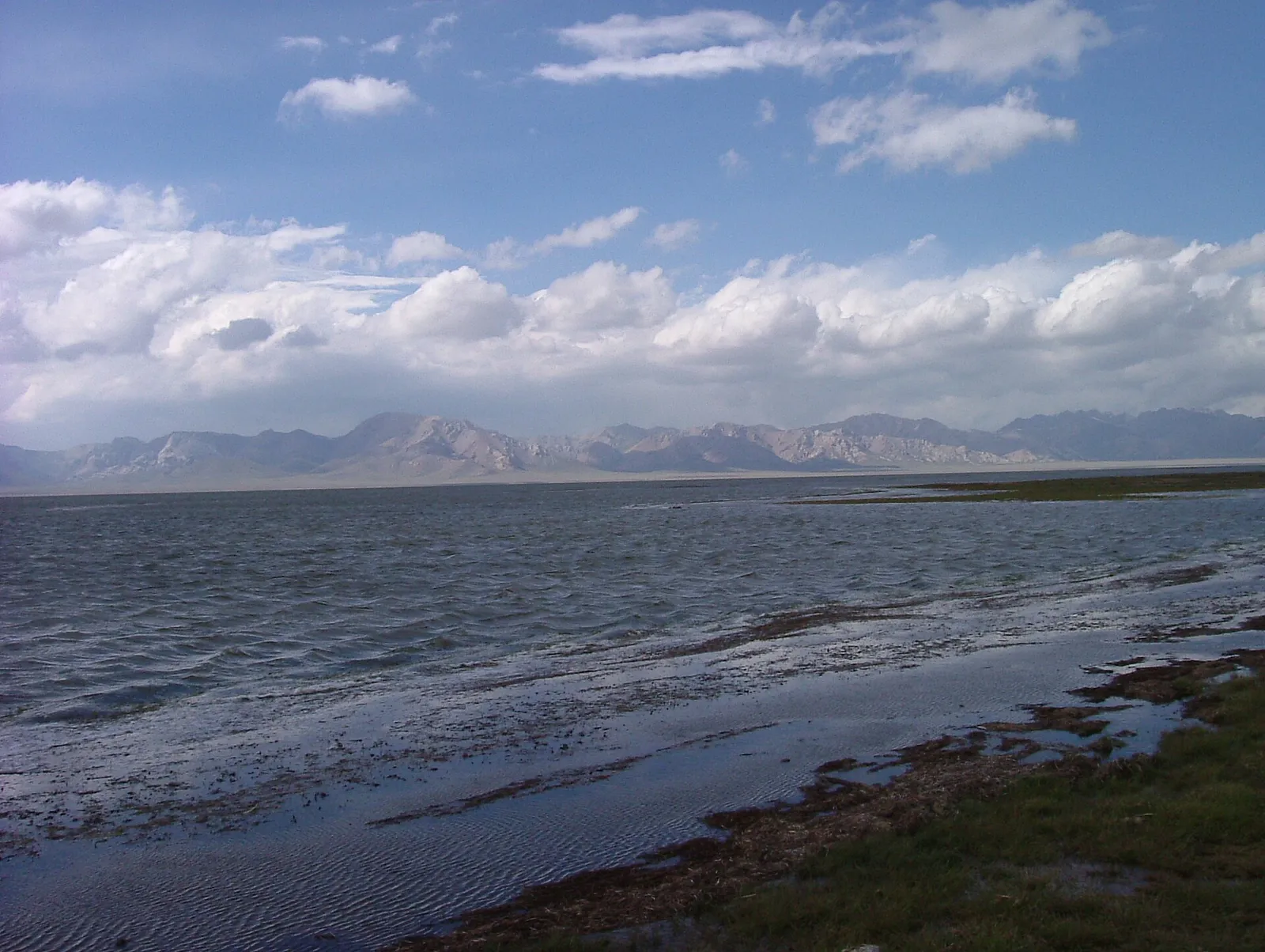 Wide high-altitude plain around Chatyr-Kul Lake with mountains behind