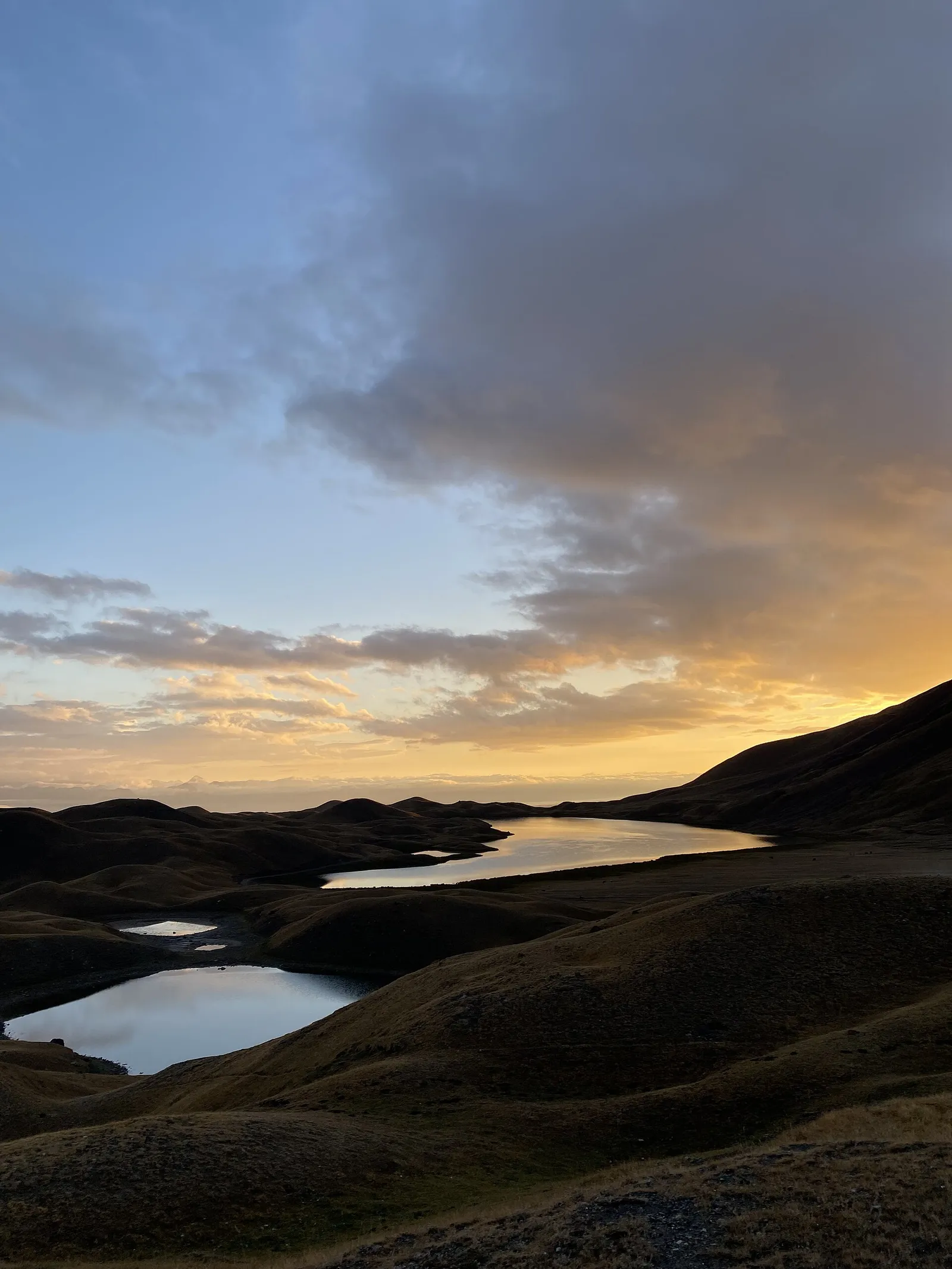 Tulpar-Kul lake with yurts on the shore and Lenin Peak behind